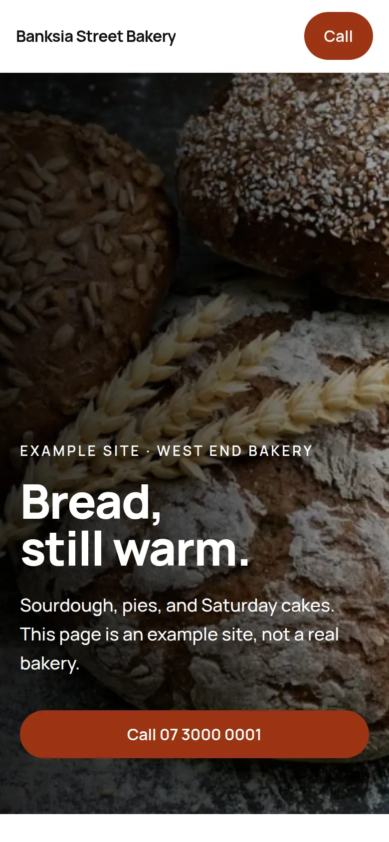 A phone showing an example bakery website